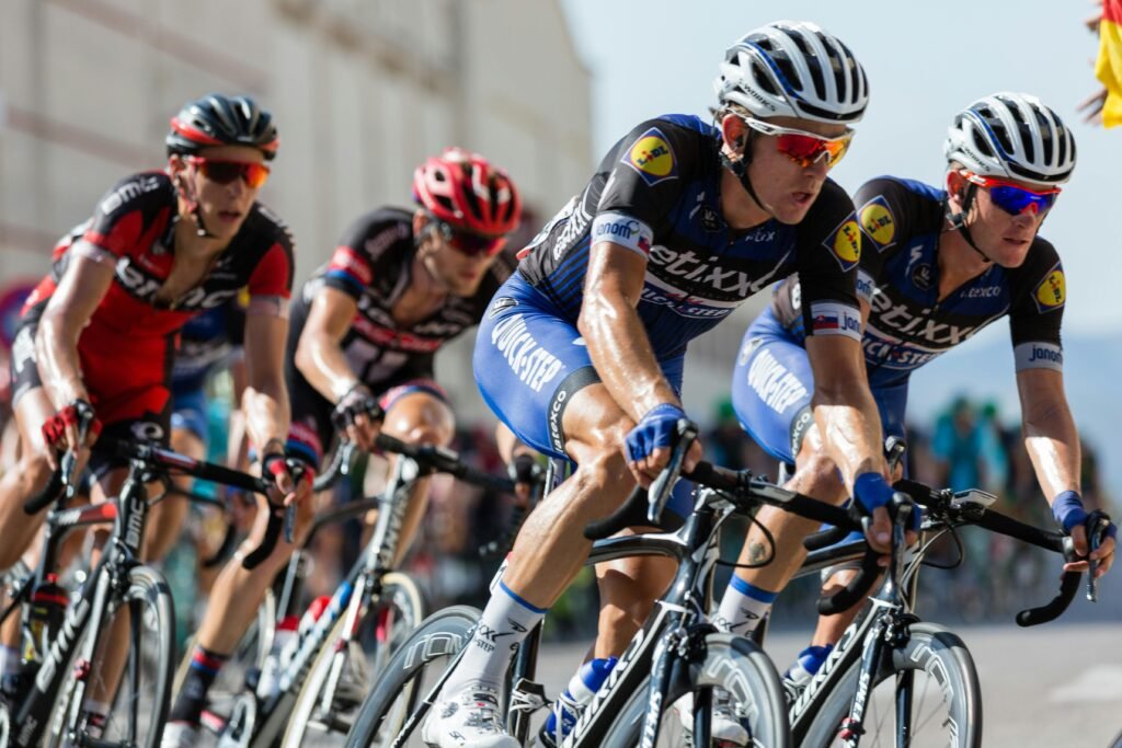pexels-photo-248547-248547 Competitive cyclists in a high-speed race, showcasing athleticism and teamwork.