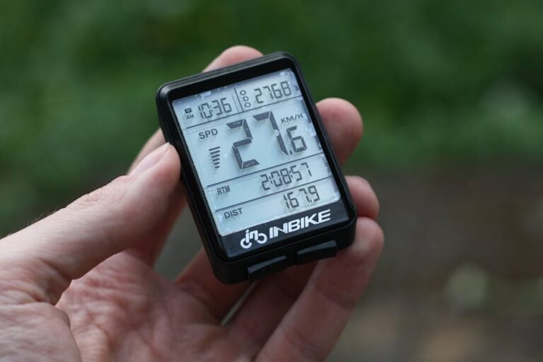 Detailed shot of digital bike speedometer displaying speed, distance, and time.